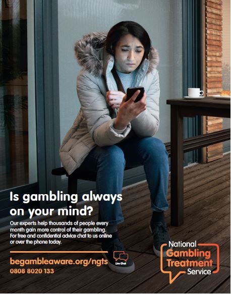 Women sits outside, intently looking at her phone wondering whether or not to call. Text states "Is gambling always on your Mind? Our experts help thousands of people every month gain more control of their gambling. For free and confidential advice chat to us online or over the phone today."