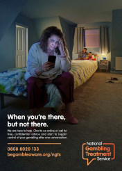 "National Gambling Treatment Service Campaign" poster of a troubled women sat on the end her child's bed away from her family, using her phone. Text overlays stating "When you’re there, but not there. We are here to help. Chat to us online or call for free, confidential advice and start to regain control of your gambling after one conversation."